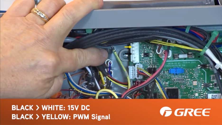 Testing black to white and black to yellow wire connections showing 15V DC and PWM signal on GREE FLEXX air handler control board